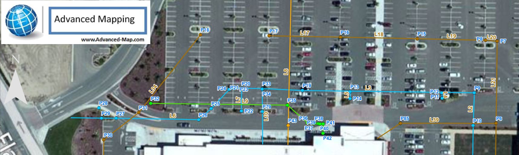 commercial parking lot showing storm drain, water, sewer and phone utilities, around main building